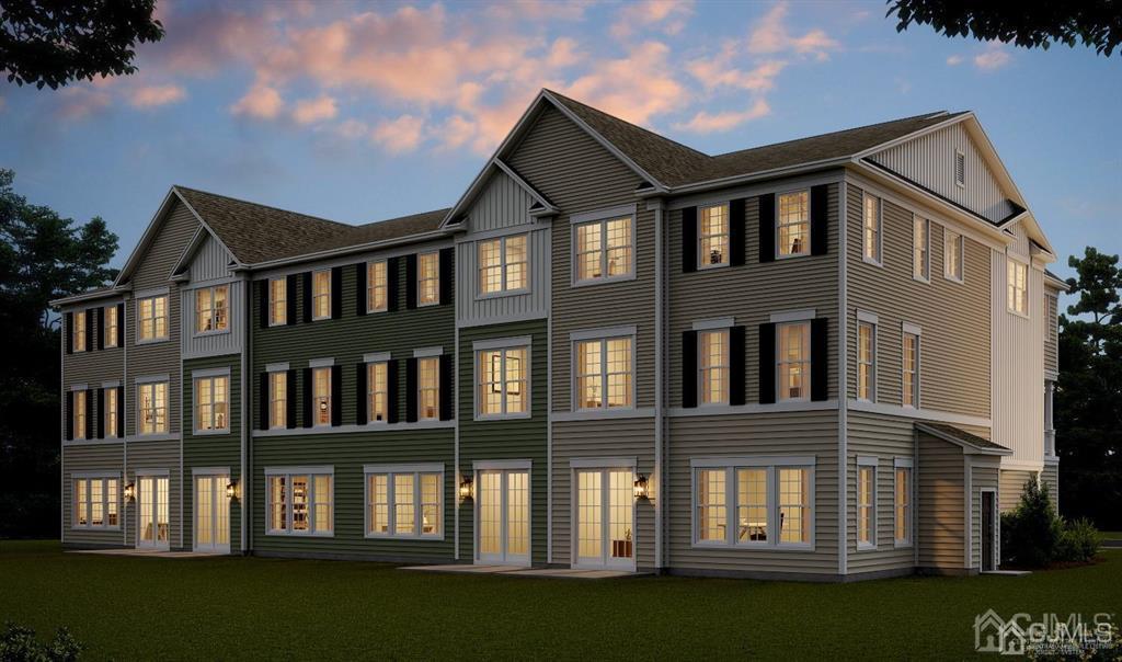 734 Station Road, Unit 512 Dunellen, NJ 08812 - Photo 3 of 6 a front view of a building with a garden