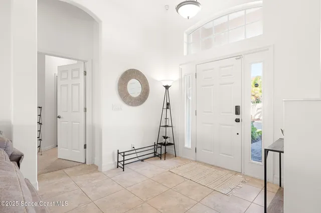 a view of a livingroom with wooden floor and white walls
