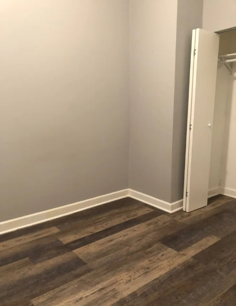 2950 North Sheffield Avenue, Unit 2F Chicago, IL 60657 - Photo 4 of 7 a view of empty room with wooden floor
