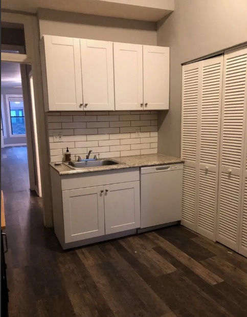 2950 North Sheffield Avenue, Unit 2F Chicago, IL 60657 - Photo 7 of 7 a kitchen with a sink and cabinets