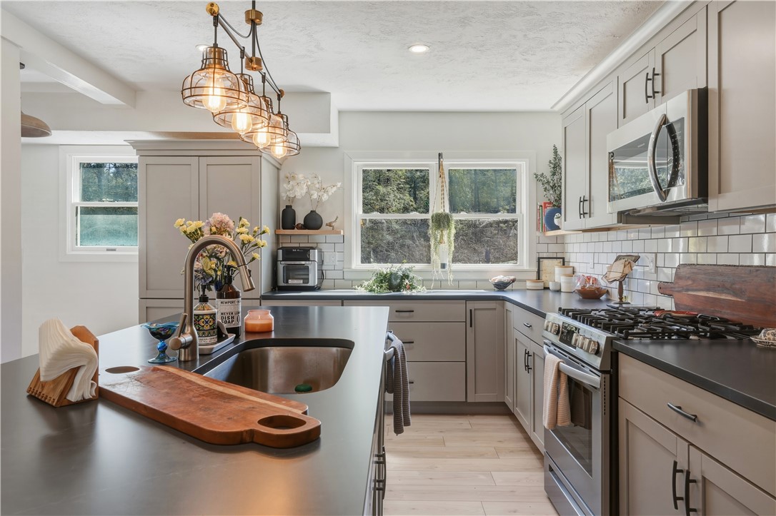 10684 Bear Run Road Caton, NY 14830 - Photo 4 of 32 The kitchen features a center island with a breakf