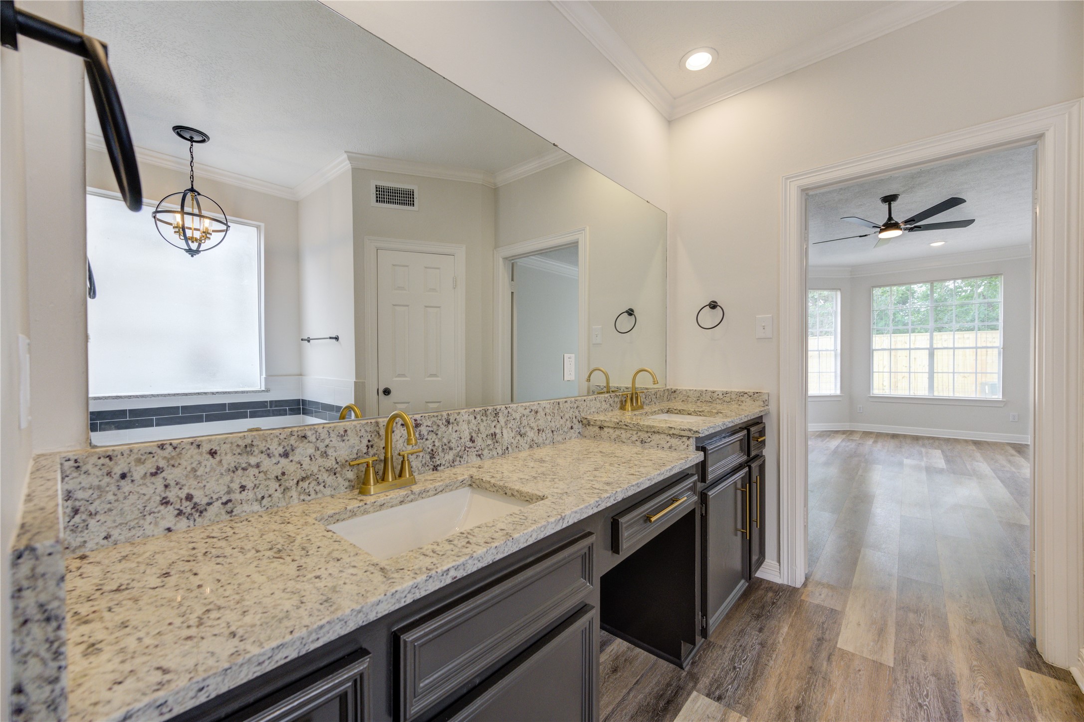 17318 Bonnard Circle Spring, TX 77379 - Photo 29 of 45 The vanity area offers new granite and undermount sinks, new gold faucets and new, matching gold cabinet pulls. It is very stylish and chic!