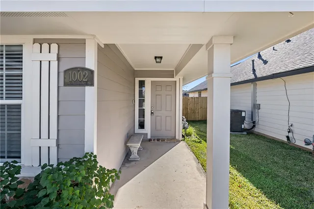 a view of a hallway with wooden walls and stairs
