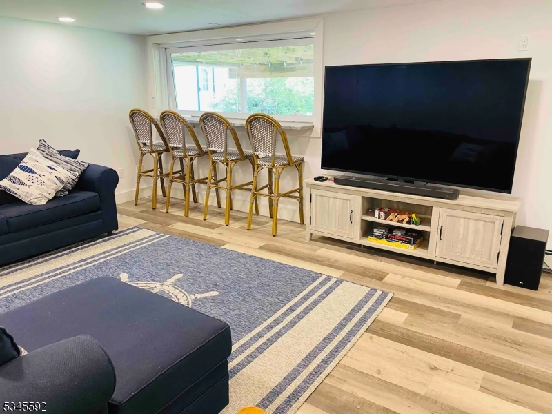857 East Shore Road West Milford, NJ 07421 - Photo 13 of 31 a living room with furniture and a flat screen tv