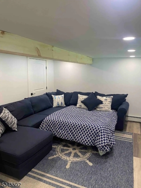 857 East Shore Road West Milford, NJ 07421 - Photo 15 of 31 a bedroom with a bed and a couch