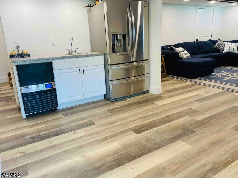 857 East Shore Road West Milford, NJ 07421 - Photo 16 of 31 a kitchen with a refrigerator and a sink