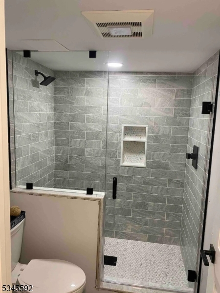 857 East Shore Road West Milford, NJ 07421 - Photo 17 of 31 a bathroom with a toilet and shower
