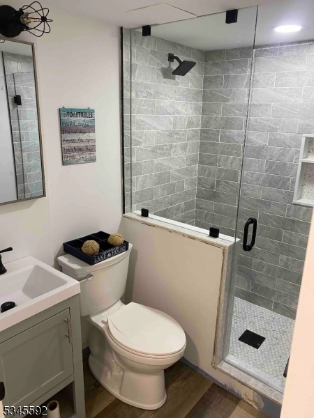 857 East Shore Road West Milford, NJ 07421 - Photo 18 of 31 a white toilet sitting next to a bathroom sink