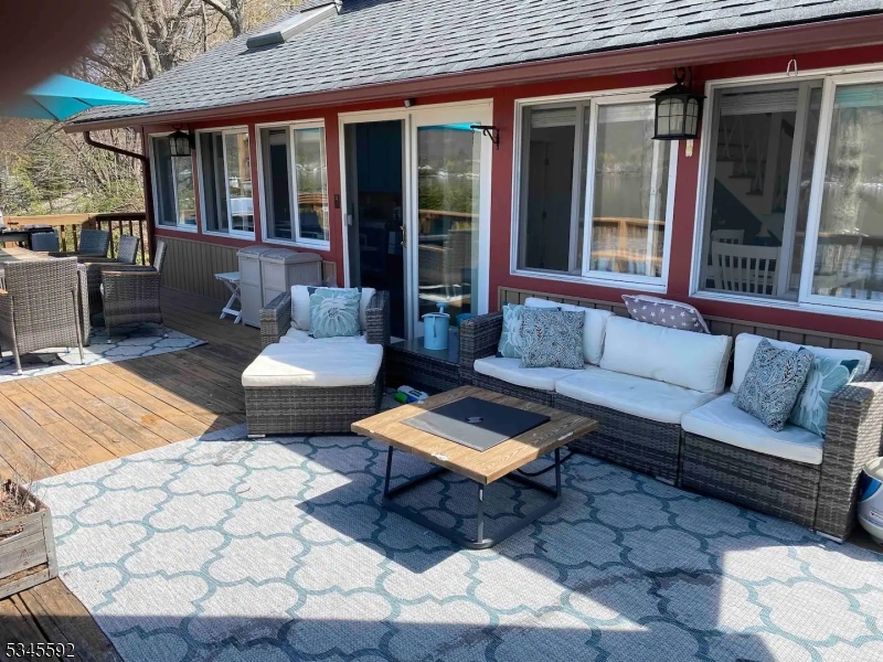 857 East Shore Road West Milford, NJ 07421 - Photo 26 of 31 a view of a patio with couches and a table and chairs