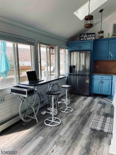 857 East Shore Road West Milford, NJ 07421 - Photo 5 of 31 a kitchen with granite countertop a stove a refrigerator and wooden cabinets