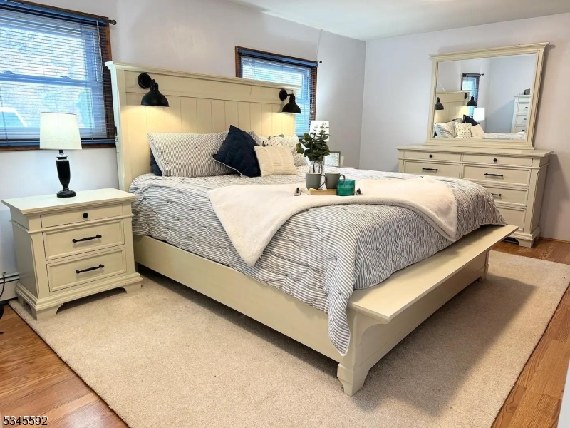 857 East Shore Road West Milford, NJ 07421 - Photo 8 of 31 a bedroom with a bed and a dresser