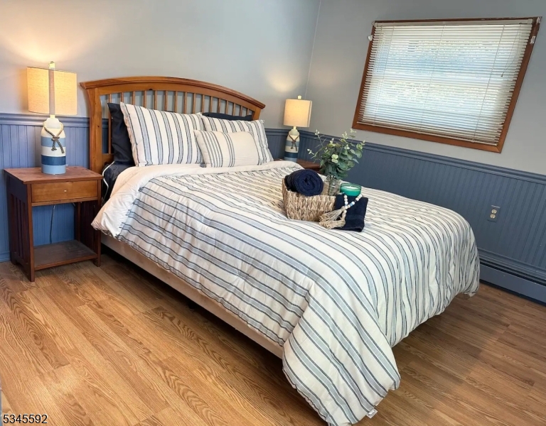 857 East Shore Road West Milford, NJ 07421 - Photo 9 of 31 a bedroom with a bed and window