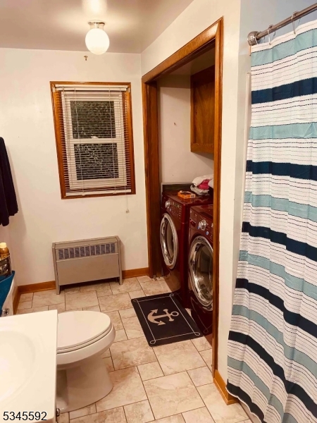857 East Shore Road West Milford, NJ 07421 - Photo 10 of 31 a bathroom with a toilet a sink and a mirror