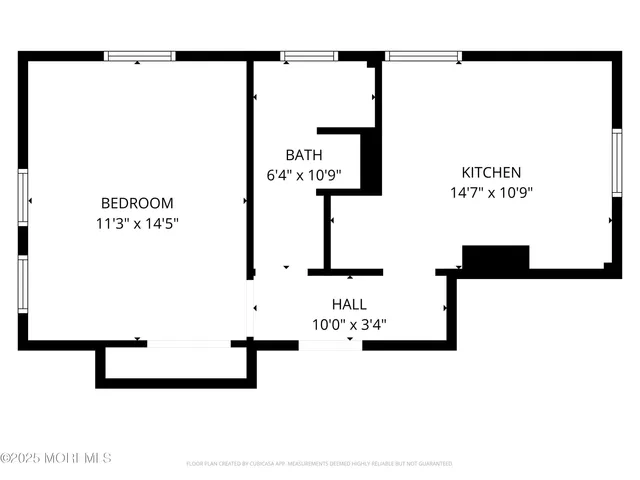 a picture of floor with a white wall and a painting