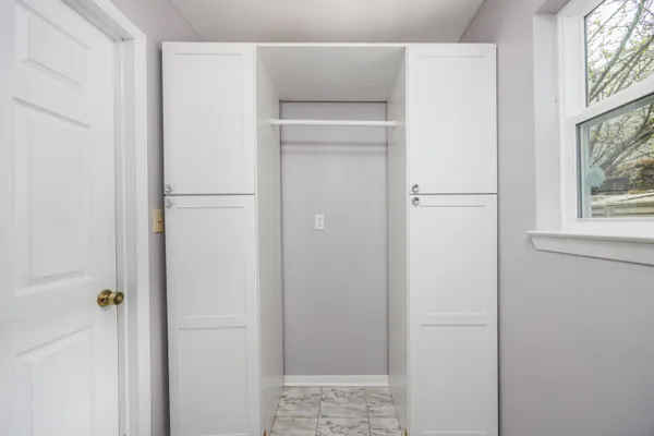a view of walk in closet with window