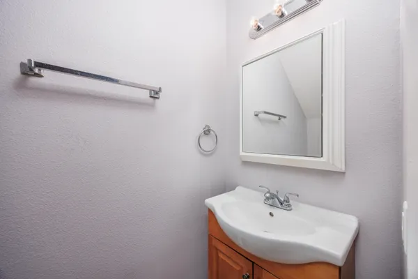 a bathroom with a sink and mirror