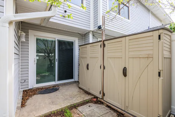 a view of a house with a door and wooden floor