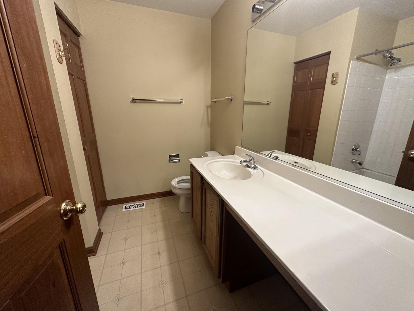 2418 Oneida Lane, Unit 2418 Naperville, IL 60563 - Photo 14 of 15 a room with a sink and a mirror