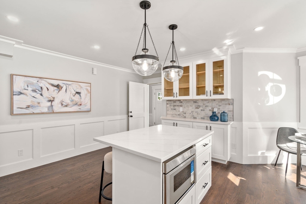 11 Macarthur Street, Unit A Somerville, MA 02145 - Photo 11 of 35 a kitchen that has a lot of cabinets in it