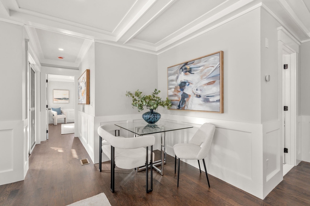 11 Macarthur Street, Unit A Somerville, MA 02145 - Photo 15 of 35 a dining room with furniture and wooden floor