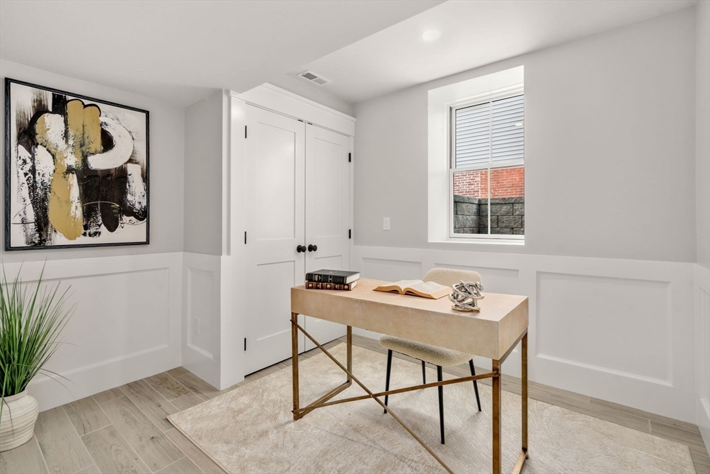 11 Macarthur Street, Unit A Somerville, MA 02145 - Photo 21 of 35 a room that has a table and a chair in it