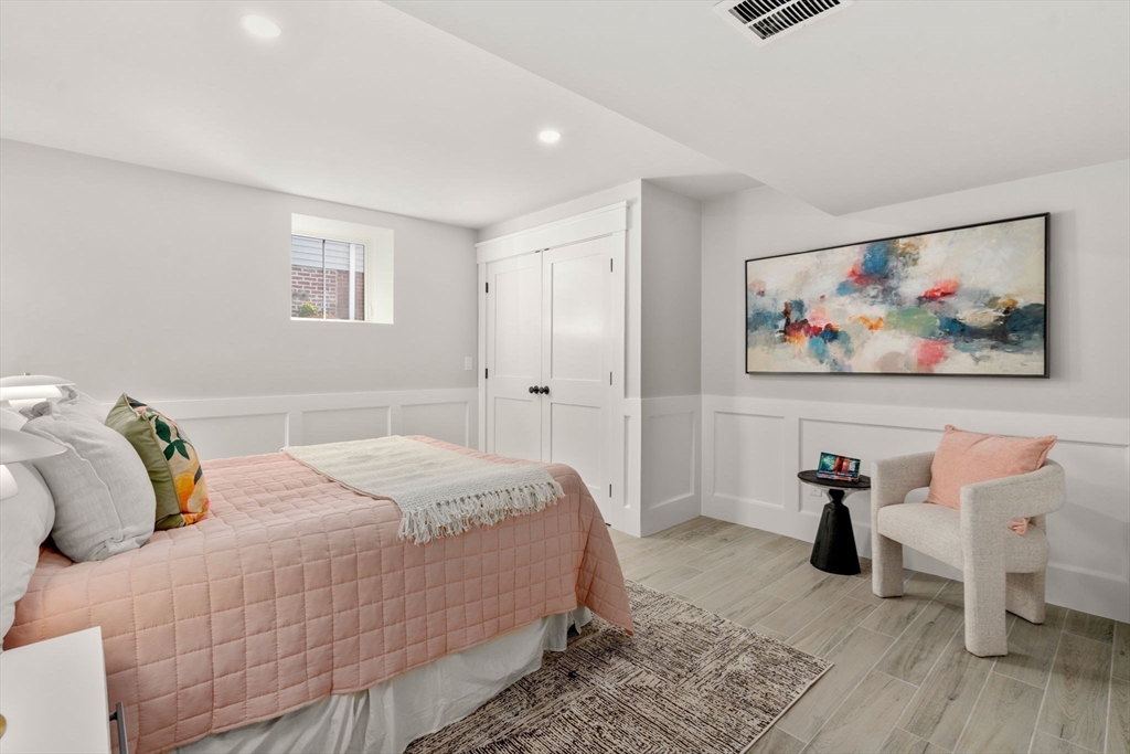 11 Macarthur Street, Unit A Somerville, MA 02145 - Photo 22 of 35 a bedroom with a bed and a view of a bedroom