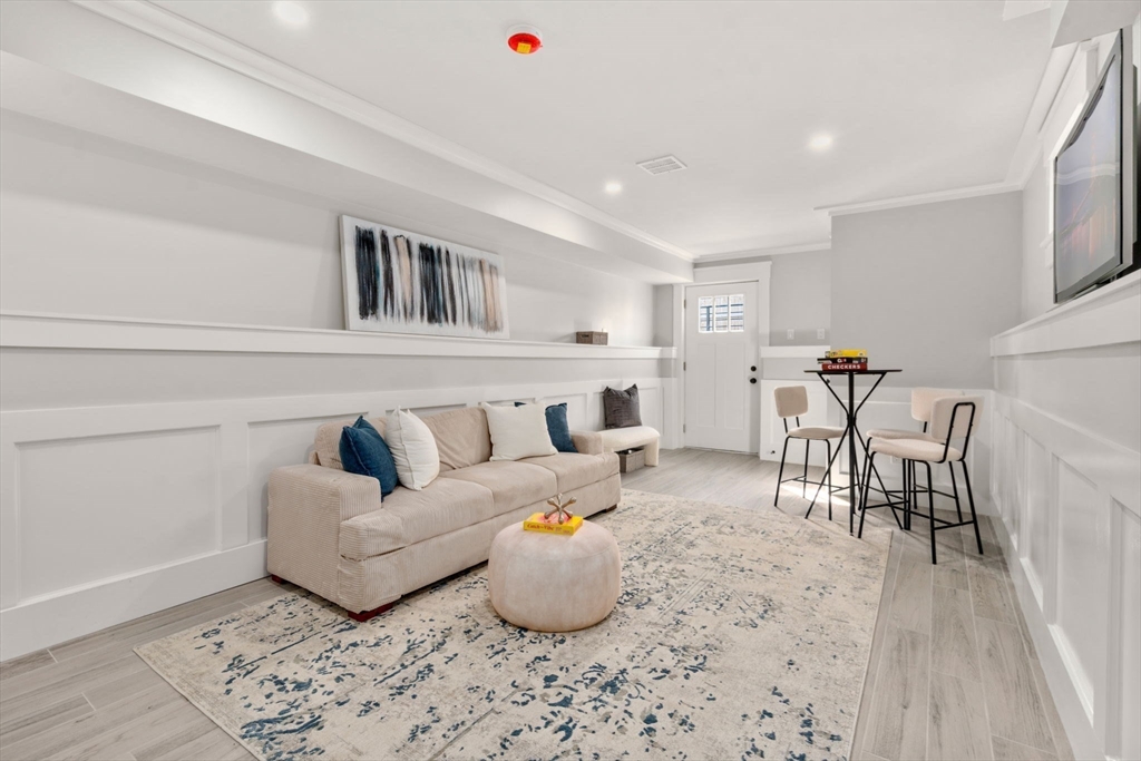 11 Macarthur Street, Unit A Somerville, MA 02145 - Photo 25 of 35 a living room with furniture and kitchen view