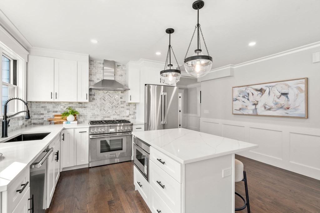 11 Macarthur Street, Unit A Somerville, MA 02145 - Photo 10 of 35 a kitchen with a stove sink and cabinets