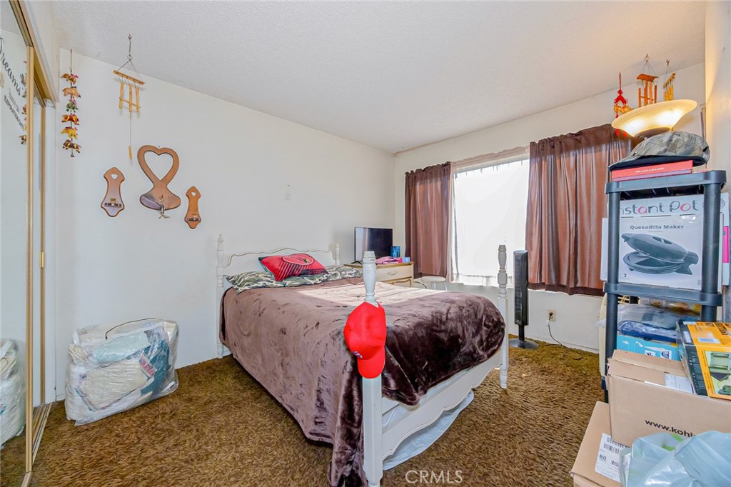 7935 Gardenia Avenue Rancho Cucamonga, CA 91701 - Photo 14 of 35 a bedroom with a bed and window