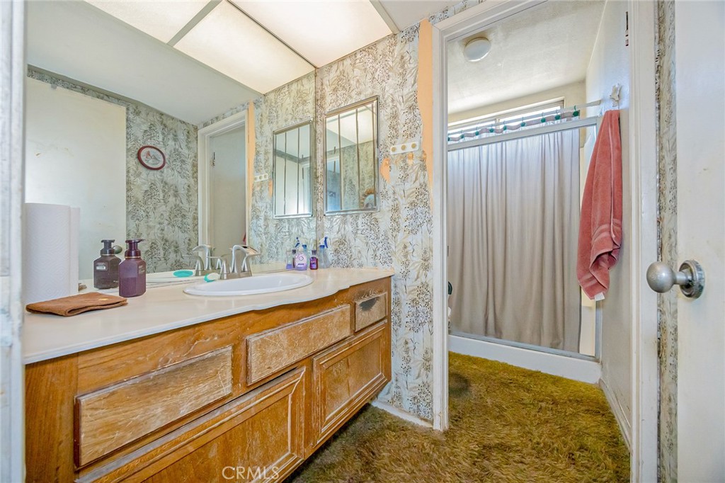7935 Gardenia Avenue Rancho Cucamonga, CA 91701 - Photo 18 of 35 a bathroom with a sink and a mirror
