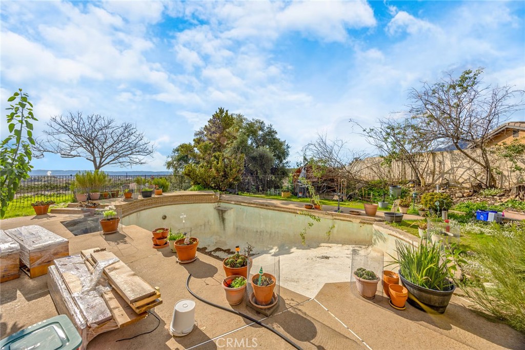 7935 Gardenia Avenue Rancho Cucamonga, CA 91701 - Photo 27 of 35 a view of backyard with swimming pool and outdoor seating