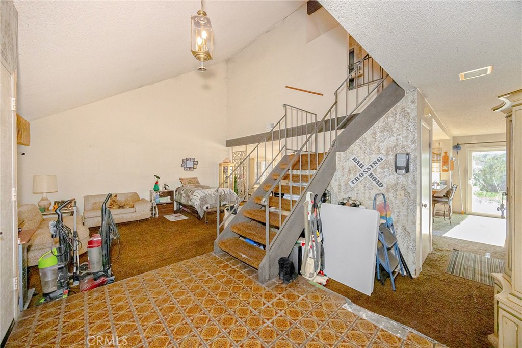 7935 Gardenia Avenue Rancho Cucamonga, CA 91701 - Photo 4 of 35 a living room with lots of furniture and white walls