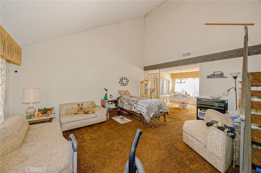 7935 Gardenia Avenue Rancho Cucamonga, CA 91701 - Photo 5 of 35 a spacious bedroom with a bed and a couch