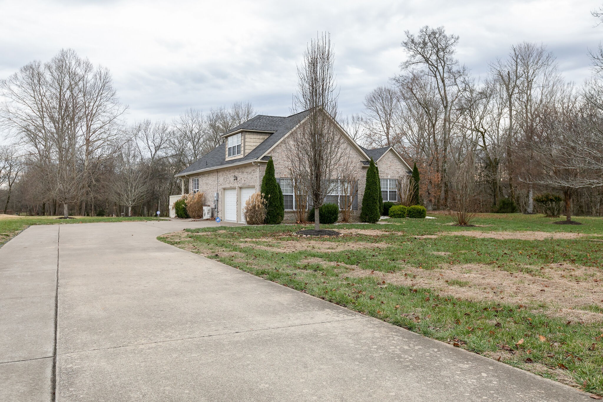1954 Lasea Road Spring Hill, TN 37174 - Photo 3 of 35 a view of a white house with a big yard and large trees