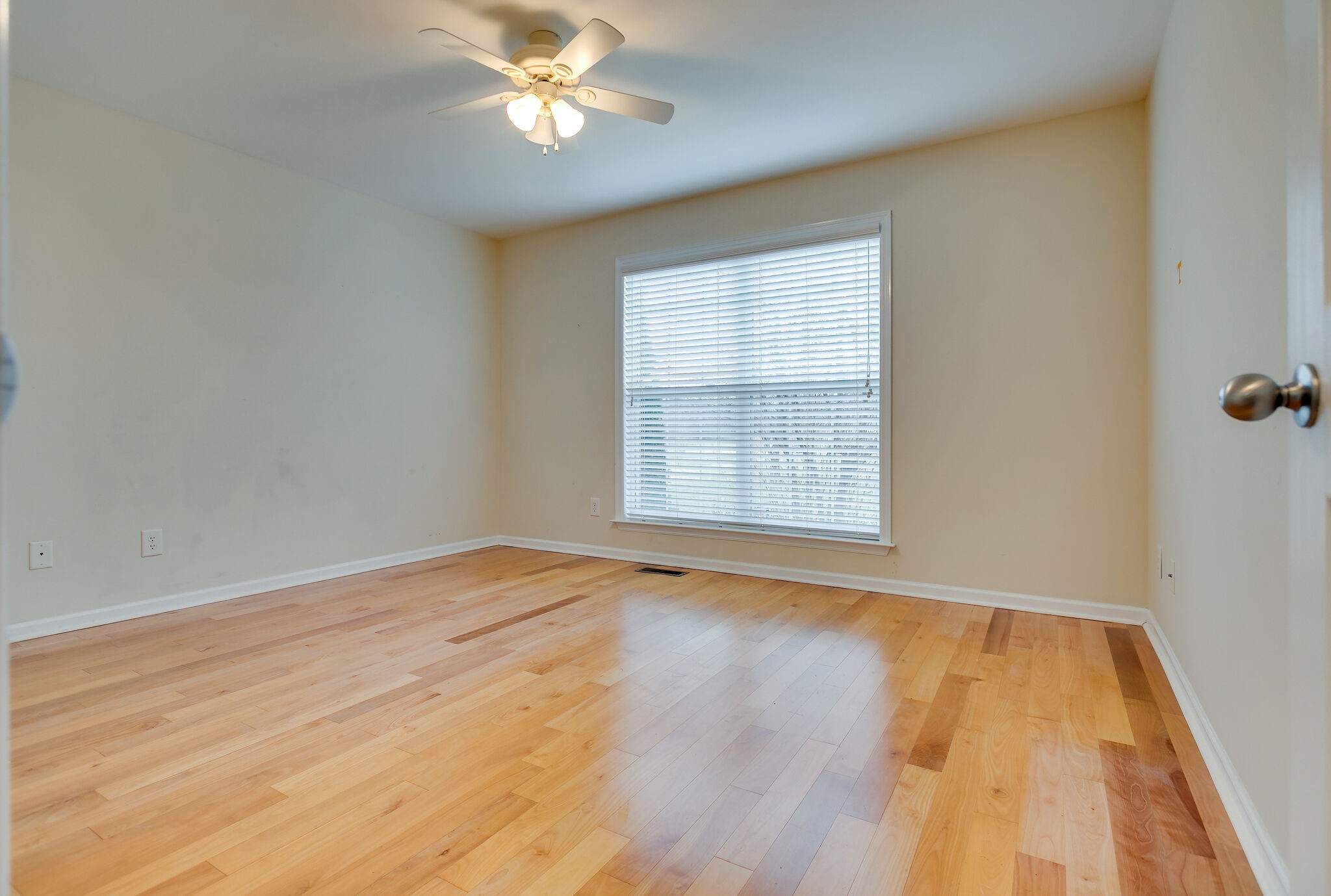 1954 Lasea Road Spring Hill, TN 37174 - Photo 22 of 35 a view of an empty room with wooden floor and a window
