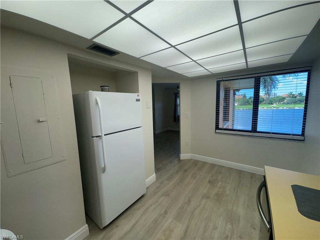 1530 Mainsail Drive, Unit 11 Naples, FL 34114 - Photo 11 of 26 a refrigerator freezer sitting inside of a kitchen