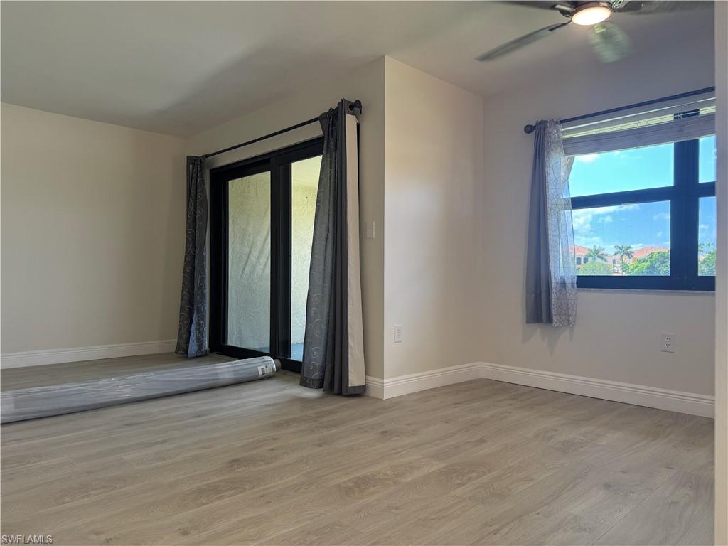1530 Mainsail Drive, Unit 11 Naples, FL 34114 - Photo 6 of 26 an empty room with a window