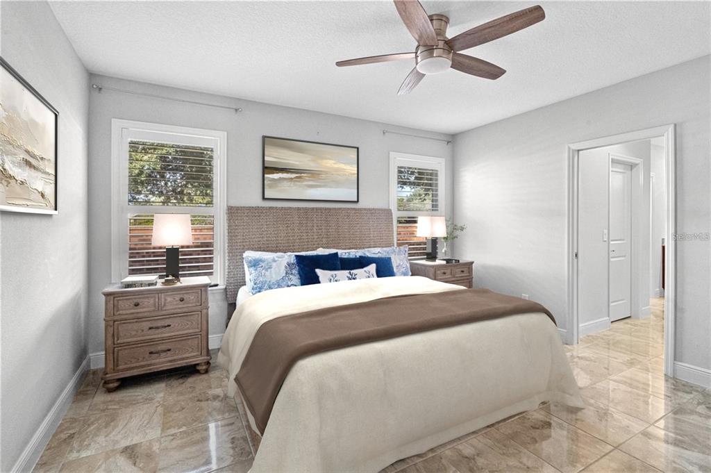 2812 Roseglen Way Orlando, FL 32812 - Photo 11 of 20 a bedroom with a bed and a window