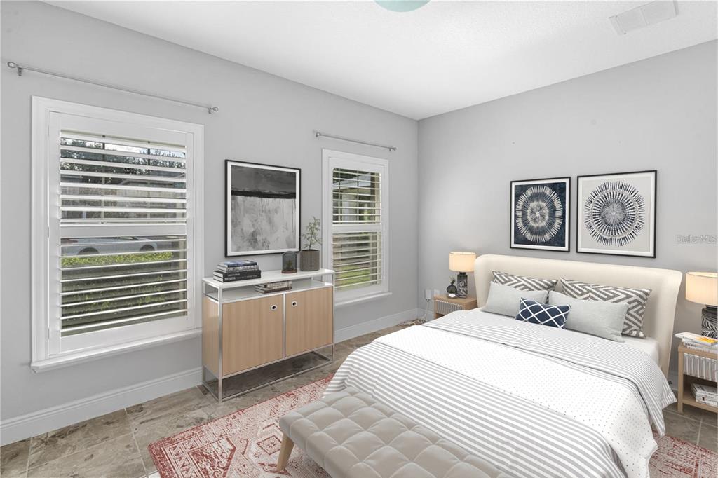 2812 Roseglen Way Orlando, FL 32812 - Photo 12 of 20 a bedroom with a bed and a window