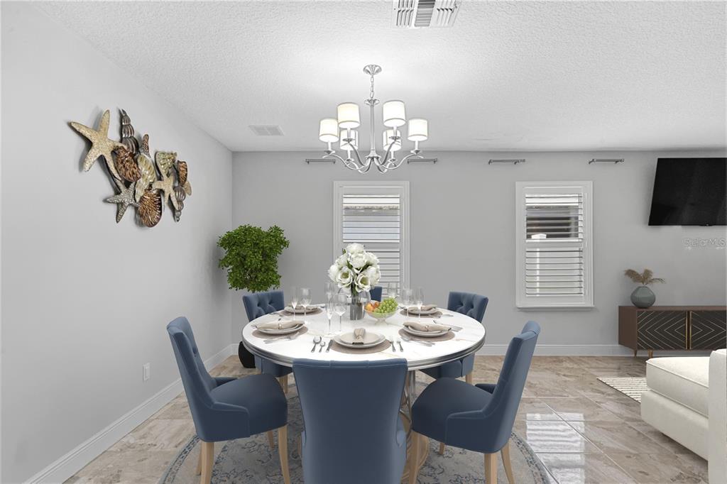 2812 Roseglen Way Orlando, FL 32812 - Photo 7 of 20 a view of a dining room with furniture window and wooden floor