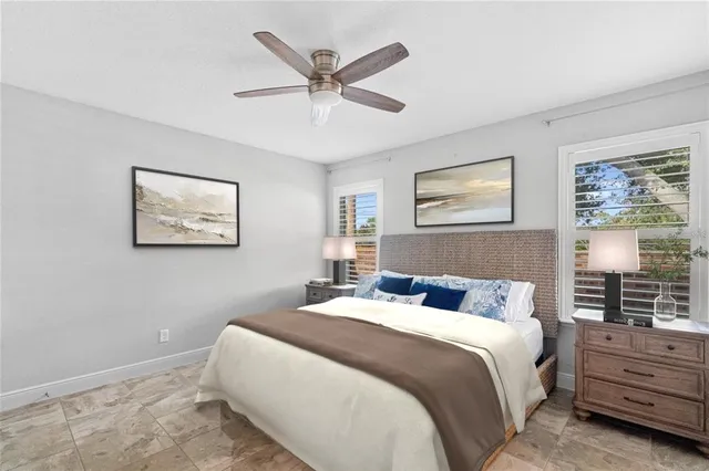 a bedroom with a large bed and a window