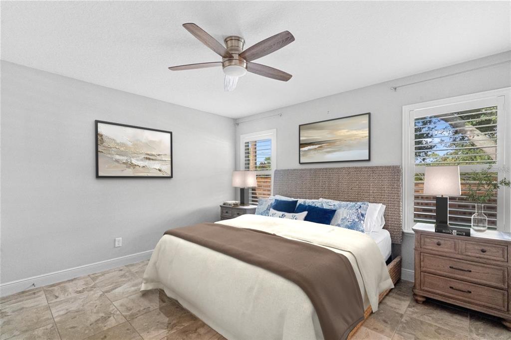 2812 Roseglen Way Orlando, FL 32812 - Photo 10 of 20 a bedroom with a large bed and a window