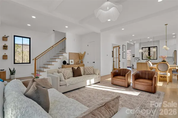 a kitchen with stainless steel appliances kitchen island granite countertop a sink and a refrigerator