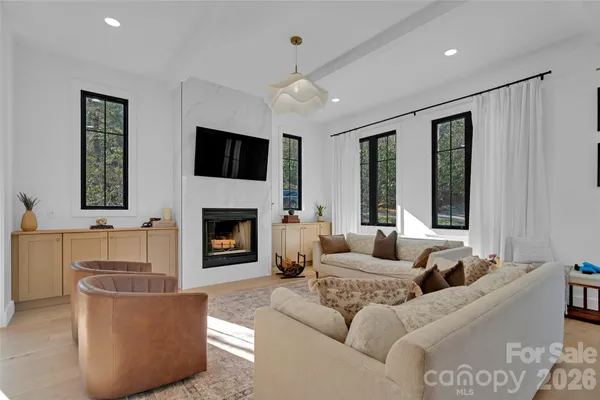 a kitchen with kitchen island granite countertop a sink stainless steel appliances and cabinets
