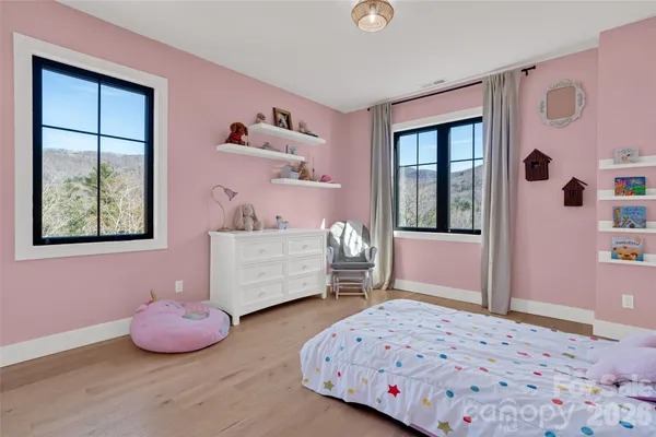 an aerial view of residential house and green space