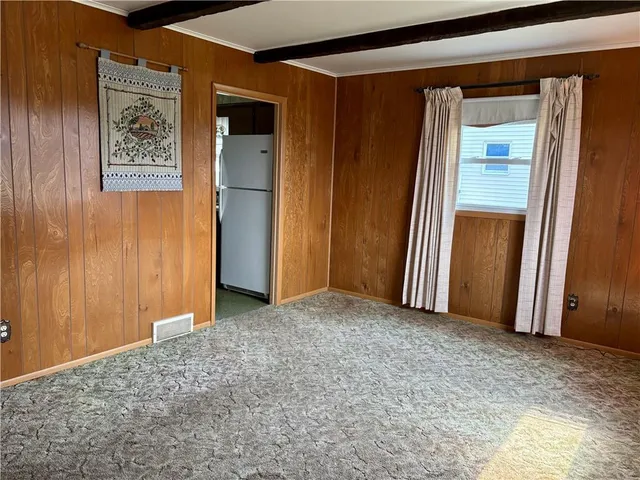 a kitchen with kitchen island a stove a sink and a refrigerator
