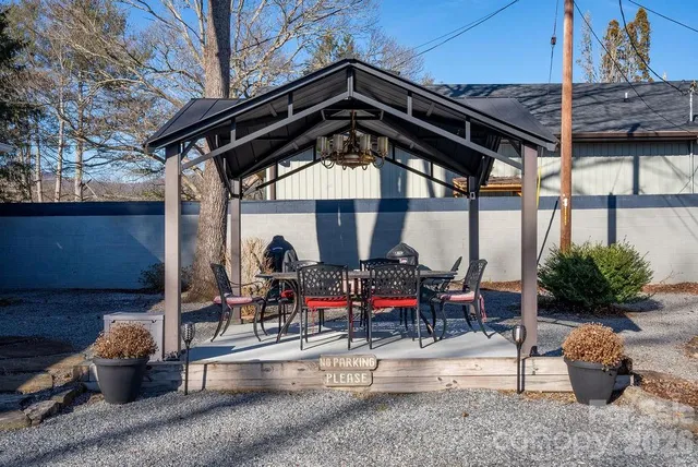 a sitting area with furniture and potted plants