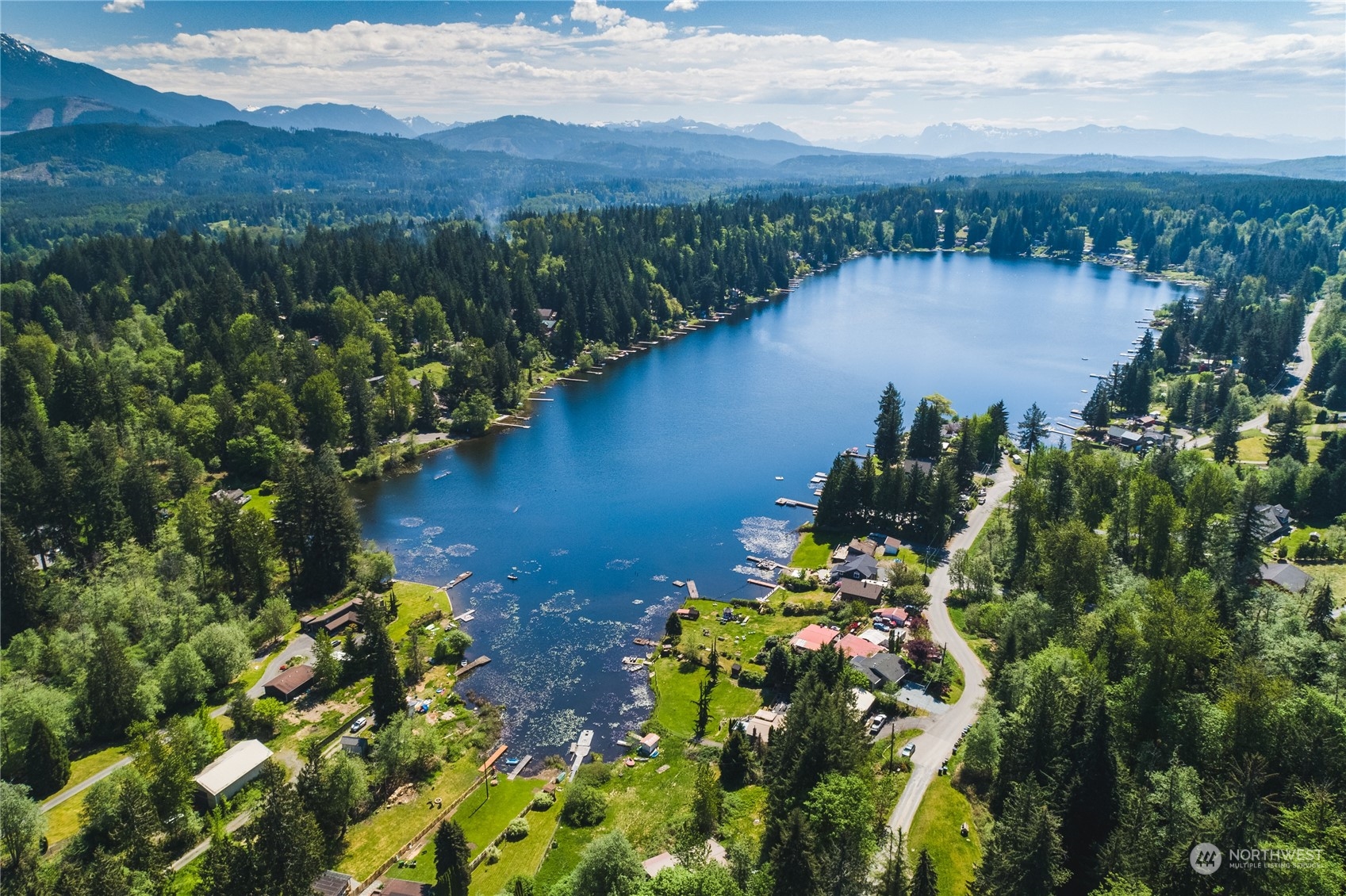 5701 Lerch Road Snohomish, WA 98290 - Photo 29 of 34 a view of a lake with mountains in the background
