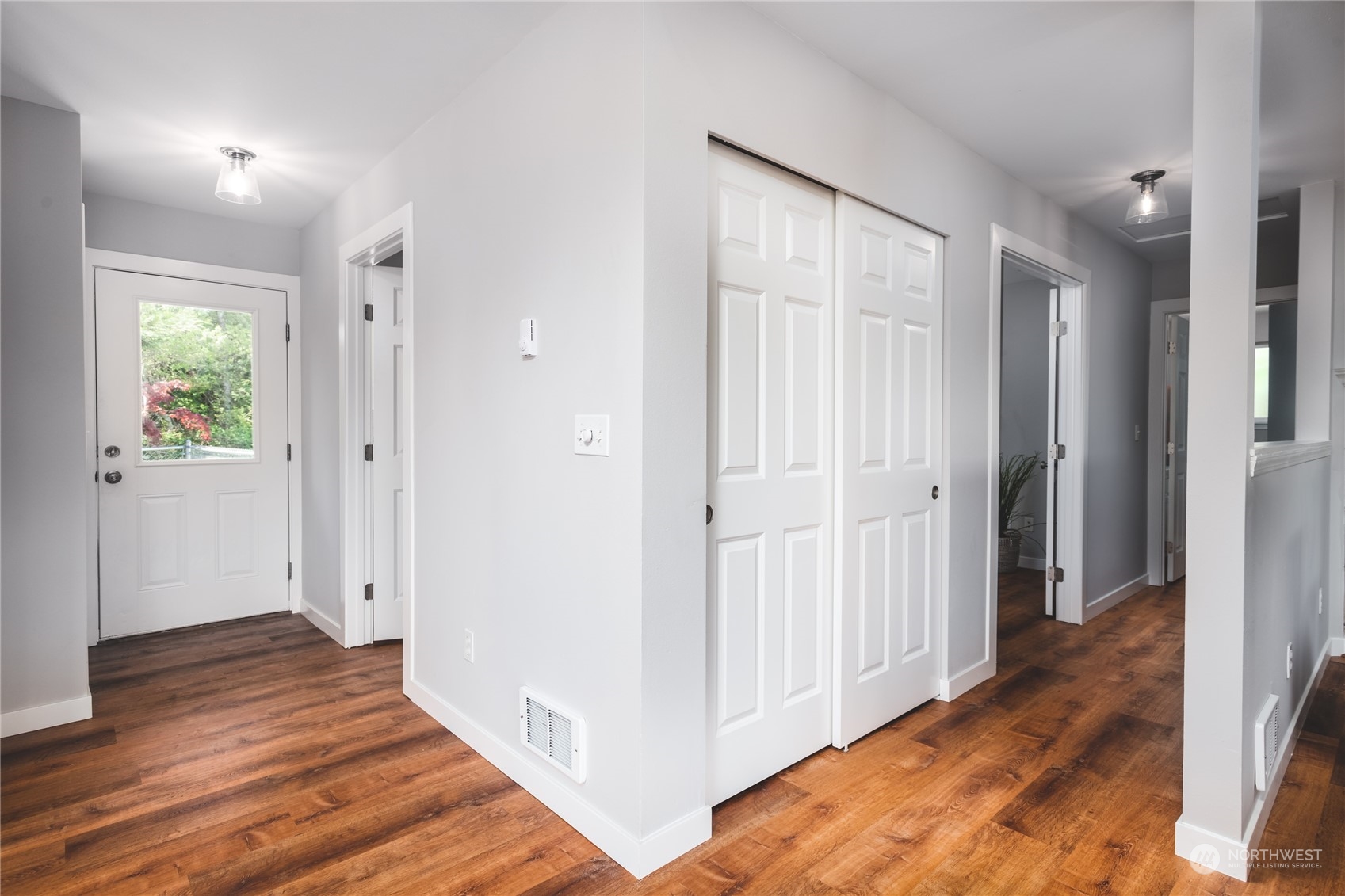 5701 Lerch Road Snohomish, WA 98290 - Photo 4 of 34 a view of a hallway with wooden floor
