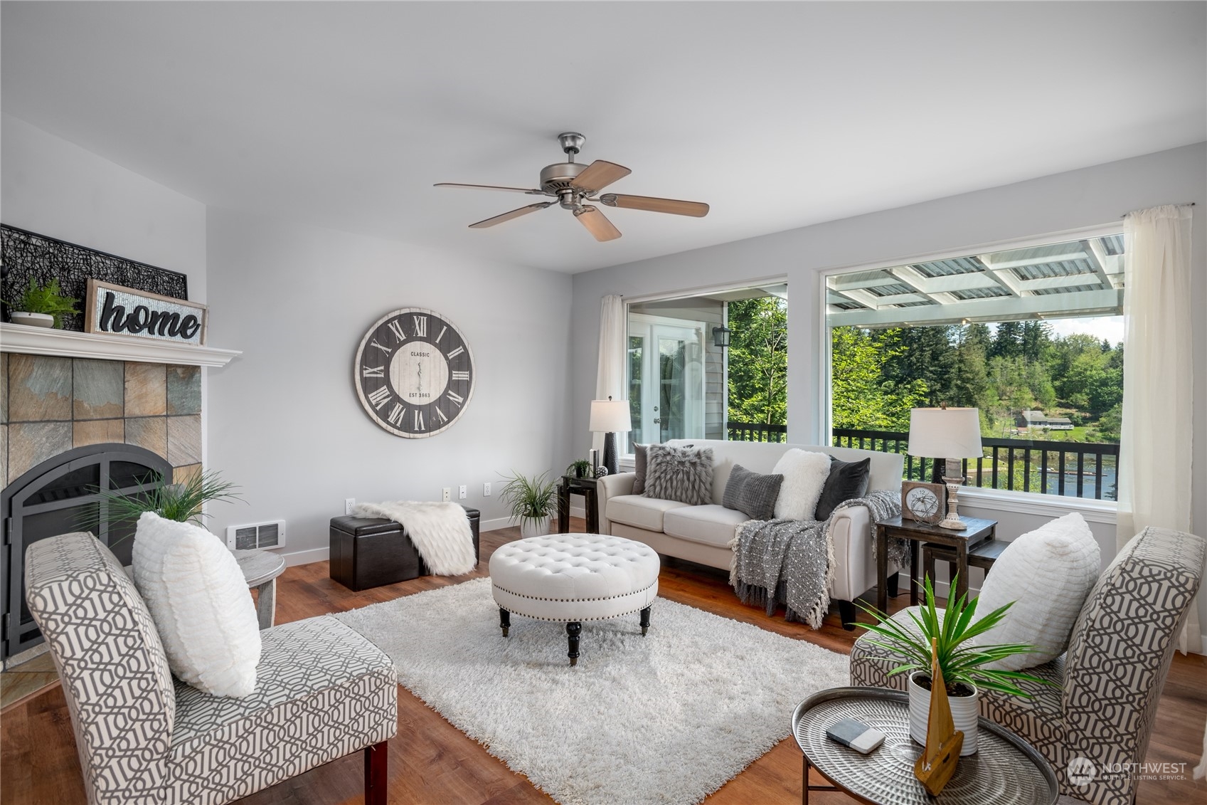 5701 Lerch Road Snohomish, WA 98290 - Photo 5 of 34 a living room with furniture a fireplace and a large window